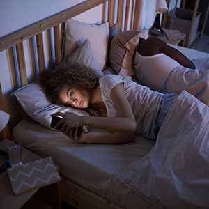 woman lying awake in bed