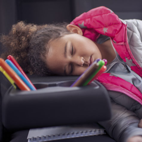 child sleeping in the car