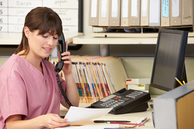 Nurse on the phone ready to help patients navigate their healthcare plan