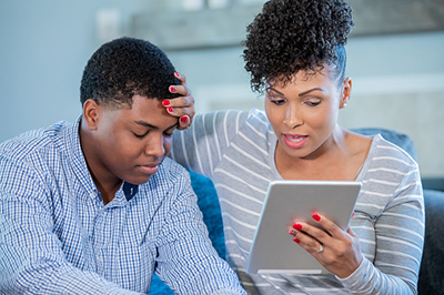 Mother with son using Covenant virtual visits