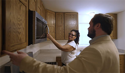Yamia Scott and Dylan Hellus touring her new home