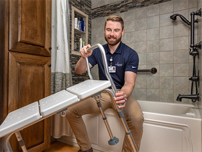 Nurse setting up a shower seat